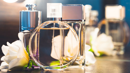 perfume bottles and flower